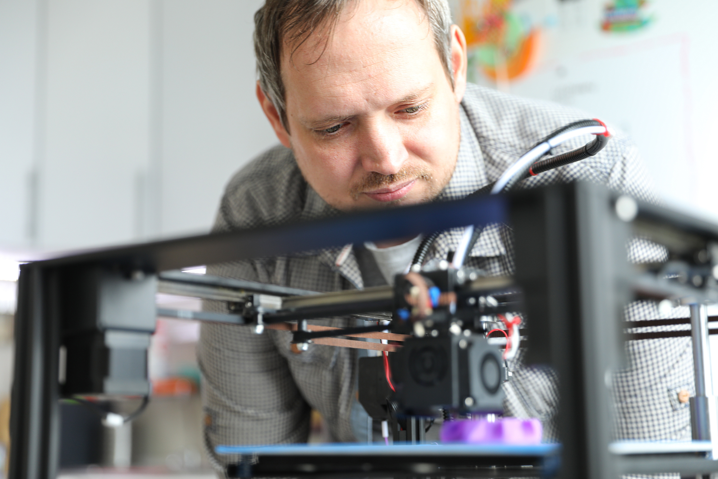 Veteran entrepreneur working on a 3D-printed prototype